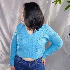 Embossed Size M cropped light blue polo sweater